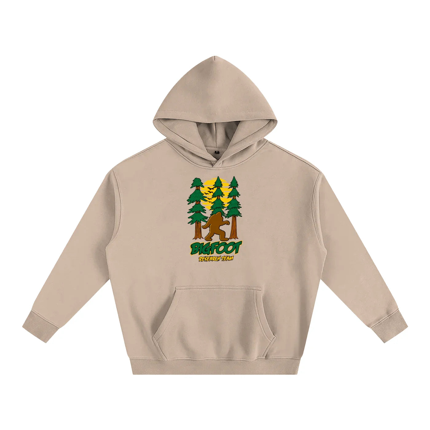 Tan hoodie with Bigfoot in forest graphic, outdoor adventure style