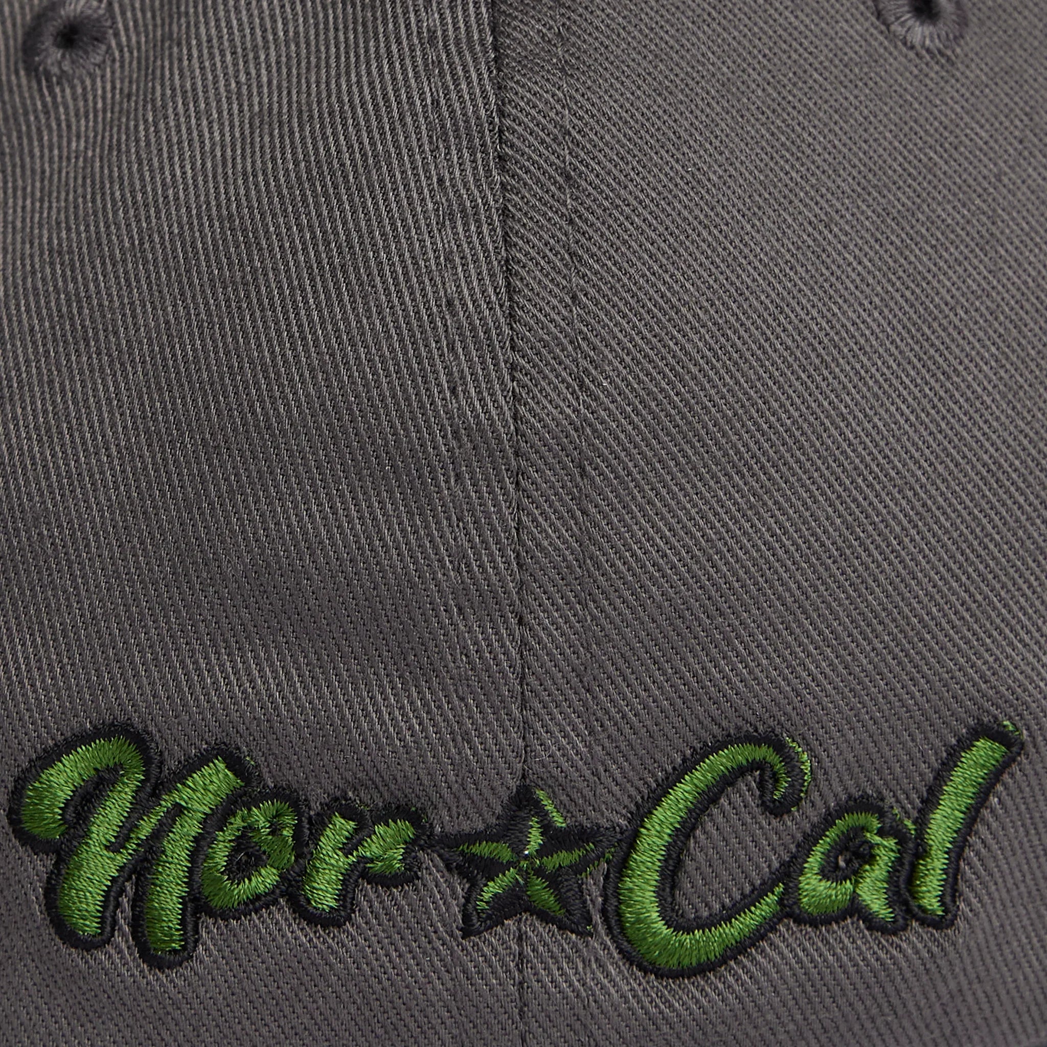 Gray cap with green 'Nor Cal' embroidery, blending outdoor and streetwear style
