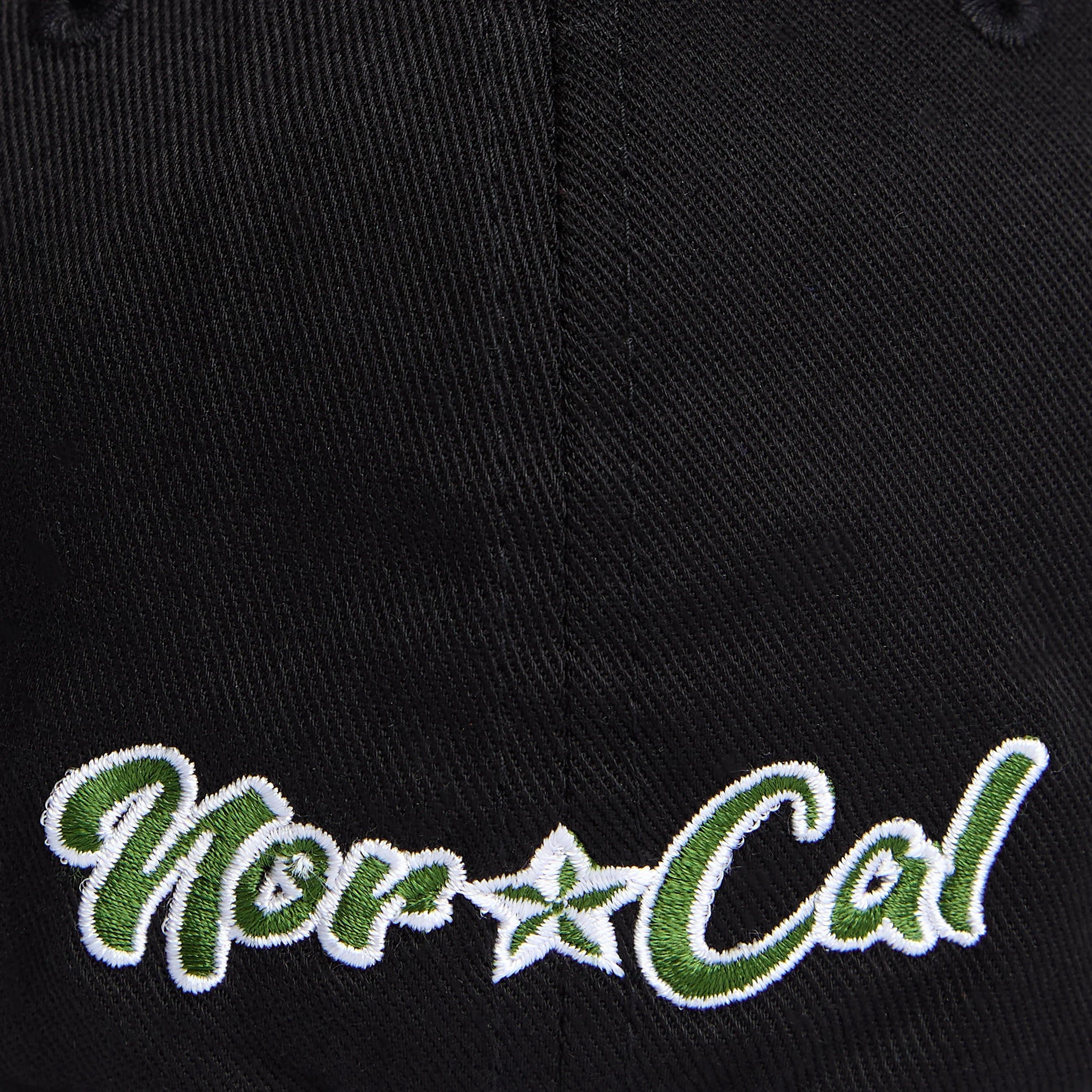 Black cap with green and white embroidered 'Humboldt Cal' logo, reflecting Northern California outdoor style.