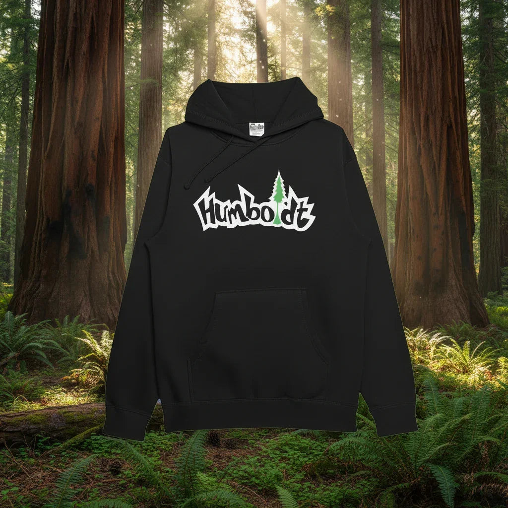Black Humboldt hoodie with tree logo, set in redwood forest, blending outdoor and streetwear style