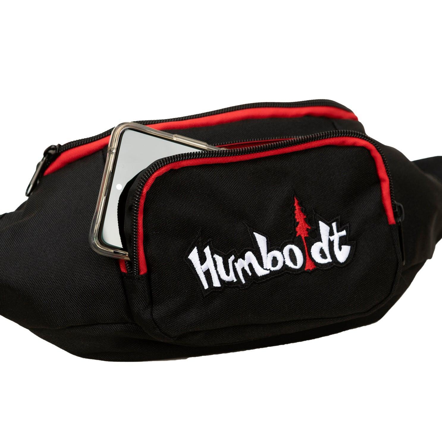 Black Humboldt fanny pack with red trim, embroidered logo, and phone pocket for outdoor or streetwear style