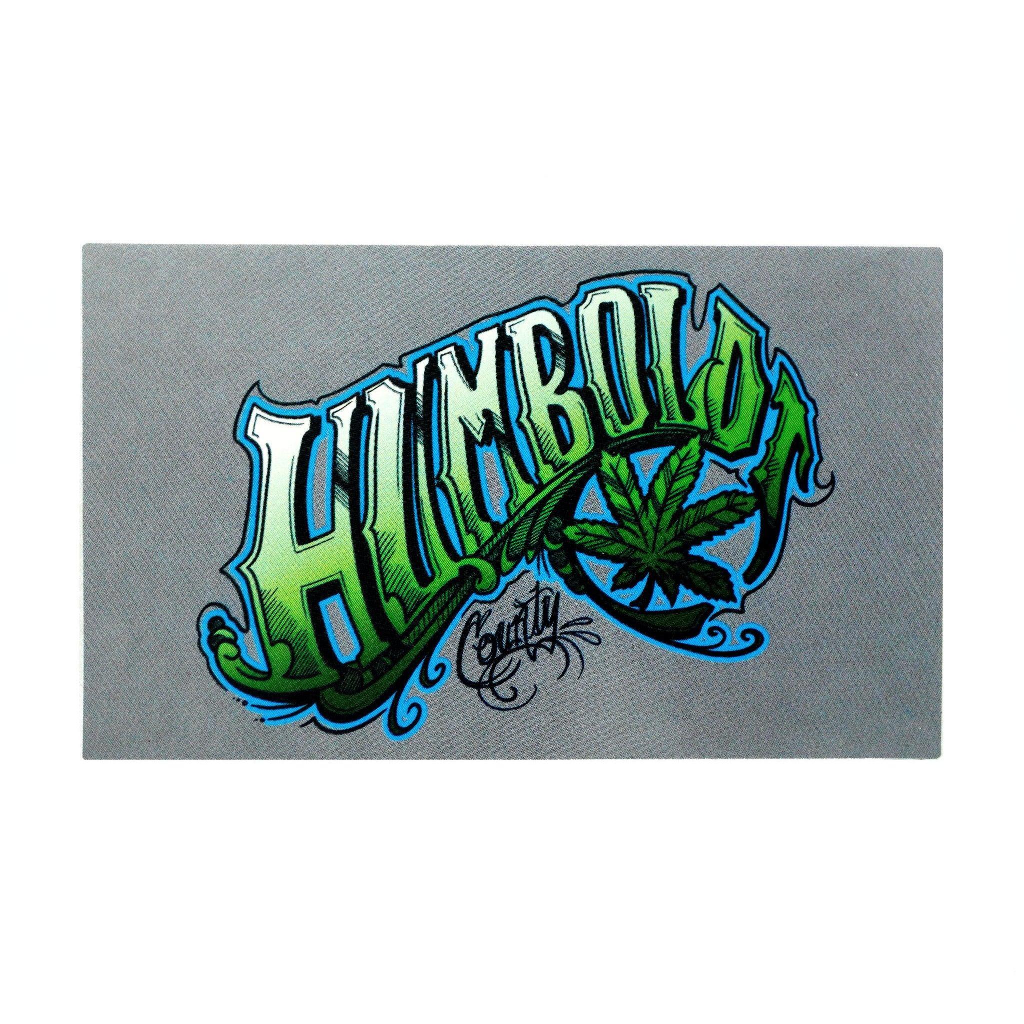 Humboldt County graphic design with green leaf and blue outline on gray background